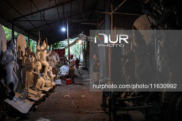 Artisans make idols ahead of Durga Puja in Dhaka, Bangladesh, on October 2, 2024. 