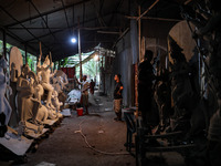 Artisans make idols ahead of Durga Puja in Dhaka, Bangladesh, on October 2, 2024. (