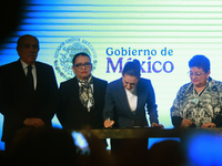 Claudia Sheinbaum Pardo, the first female President of Mexico, signs her first decree, a public apology for the student massacre of 1968, an...