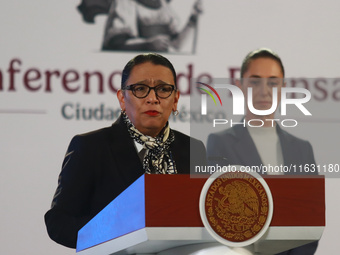 Claudia Sheinbaum Pardo, the first female President of Mexico, stands behind while Minister of Interior Rosa Icela Rodriguez speaks during t...