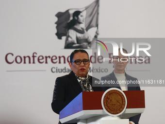 Claudia Sheinbaum Pardo, the first female President of Mexico, stands behind while Minister of Interior Rosa Icela Rodriguez speaks during t...