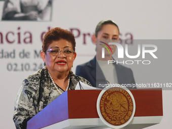 Claudia Sheinbaum Pardo, the first female President of Mexico, stands behind while Ernestina Godoy, legal advisor of the Government of Mexic...