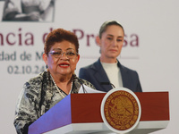 Claudia Sheinbaum Pardo, the first female President of Mexico, stands behind while Ernestina Godoy, legal advisor of the Government of Mexic...