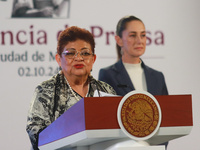 Claudia Sheinbaum Pardo, the first female President of Mexico, stands behind while Ernestina Godoy, legal advisor of the Government of Mexic...