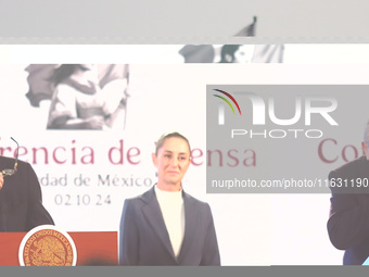 Claudia Sheinbaum Pardo, the first female President of Mexico, stands behind while Pablo Gomez, director of the Financial Intelligence Unit...