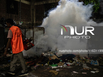 Mosquito repellent is sprayed by a fogger machine to kill mosquitoes as the case of Dengue (spread usually by Aedes mosquito) in Dhaka, Bang...