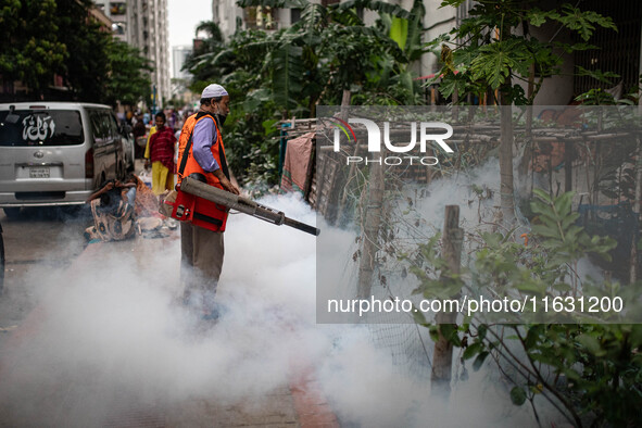 Mosquito repellent is sprayed by a fogger machine to kill mosquitoes as the case of Dengue (spread usually by Aedes mosquito) in Dhaka, Bang...