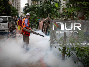 Mosquito repellent is sprayed by a fogger machine to kill mosquitoes as the case of Dengue (spread usually by Aedes mosquito) in Dhaka, Bang...