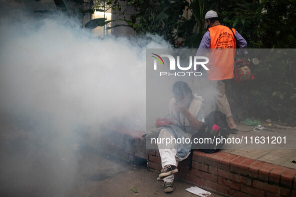 Mosquito repellent is sprayed by a fogger machine to kill mosquitoes as the case of Dengue (spread usually by Aedes mosquito) in Dhaka, Bang...