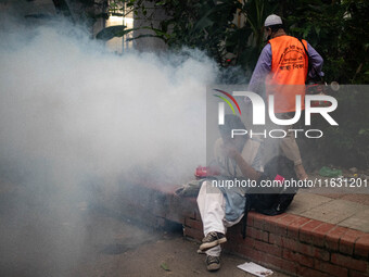 Mosquito repellent is sprayed by a fogger machine to kill mosquitoes as the case of Dengue (spread usually by Aedes mosquito) in Dhaka, Bang...