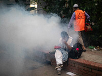 Mosquito repellent is sprayed by a fogger machine to kill mosquitoes as the case of Dengue (spread usually by Aedes mosquito) in Dhaka, Bang...