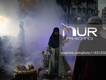 Mosquito repellent is sprayed by a fogger machine to kill mosquitoes as the case of Dengue (spread usually by Aedes mosquito) in Dhaka, Bang...