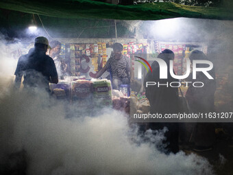 Mosquito repellent is sprayed by a fogger machine to kill mosquitoes as the case of Dengue (spread usually by Aedes mosquito) in Dhaka, Bang...