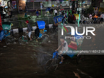 Multiple areas of the city, including many thoroughfares, are waterlogged following prolonged torrential rain in the evening on October 2, 2...