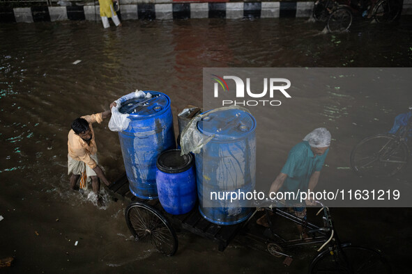 Multiple areas of the city, including many thoroughfares, are waterlogged following prolonged torrential rain in the evening on October 2, 2...