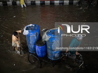 Multiple areas of the city, including many thoroughfares, are waterlogged following prolonged torrential rain in the evening on October 2, 2...