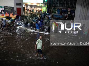 Multiple areas of the city, including many thoroughfares, are waterlogged following prolonged torrential rain in the evening on October 2, 2...