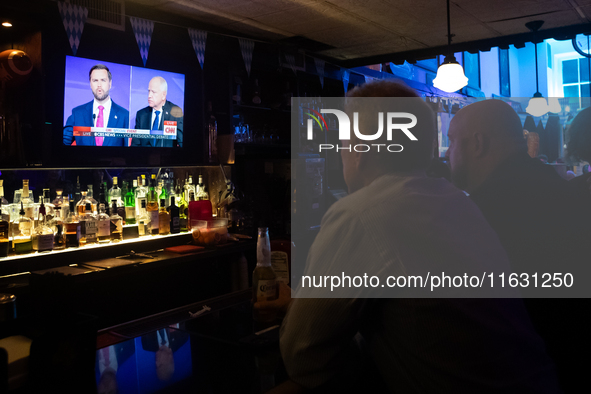 People attend a watch party at Madhatter for the vice presidential debate between Demcocrat Gov. Tim Walz (D-MN) and Republican Sen. J.D. Va...