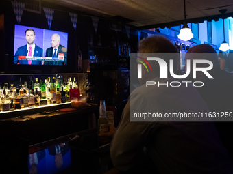 People attend a watch party at Madhatter for the vice presidential debate between Demcocrat Gov. Tim Walz (D-MN) and Republican Sen. J.D. Va...