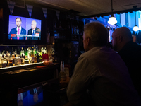 People attend a watch party at Madhatter for the vice presidential debate between Demcocrat Gov. Tim Walz (D-MN) and Republican Sen. J.D. Va...