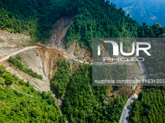 An aerial view shows roadblocks on the Dakshinkali-Sisneri road caused by landslides due to heavy rainfall in Sisneri, Makwanpur, Nepal, on...