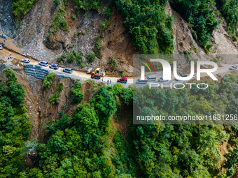 An aerial view shows roadblocks on the Dakshinkali-Sisneri road caused by landslides due to heavy rainfall in Sisneri, Makwanpur, Nepal, on...