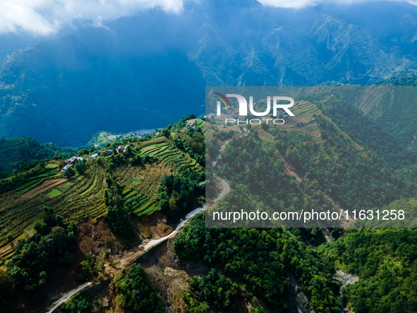 An aerial view shows roadblocks on the Dakshinkali-Sisneri road caused by landslides due to heavy rainfall in Sisneri, Makwanpur, Nepal, on...