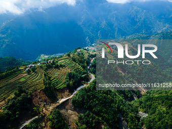 An aerial view shows roadblocks on the Dakshinkali-Sisneri road caused by landslides due to heavy rainfall in Sisneri, Makwanpur, Nepal, on...