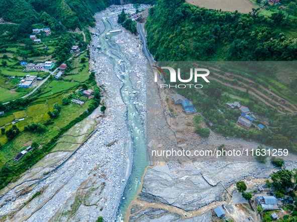 The aerial view shows the flood-affected areas of the Kulekhani River in the Sisneri region of Makwanpur, Nepal, on October 2, 2024. Thirty-...