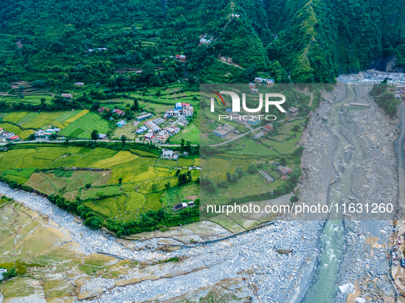 The aerial view shows the flood-affected areas of the Kulekhani River in the Sisneri region of Makwanpur, Nepal, on October 2, 2024. Thirty-...