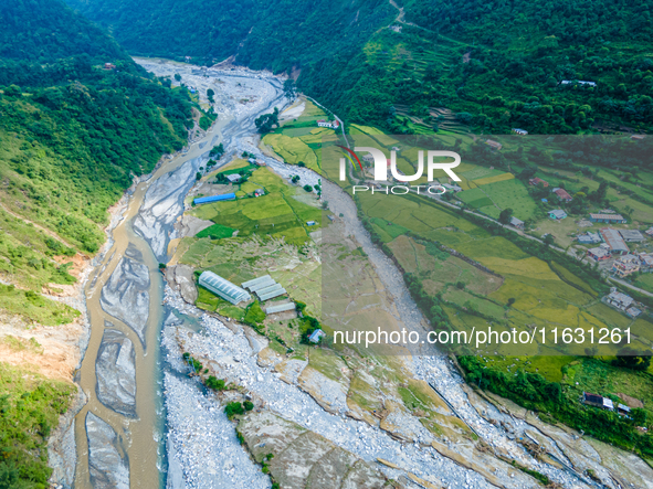 The aerial view shows the flood-affected areas of the Kulekhani River in the Sisneri region of Makwanpur, Nepal, on October 2, 2024. Thirty-...