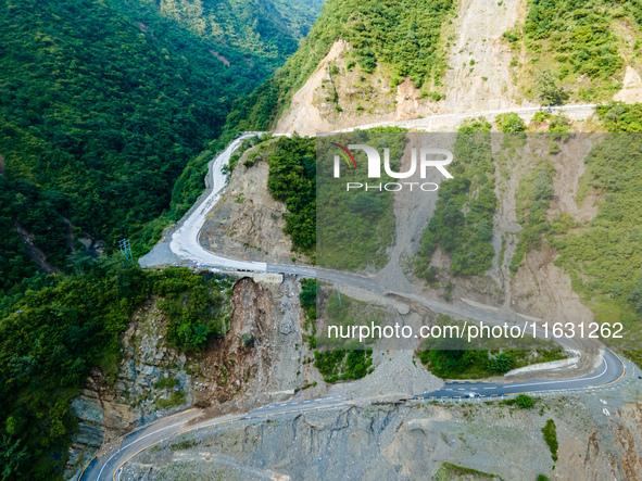 An aerial view shows roadblocks on the Dakshinkali-Sisneri road caused by landslides due to heavy rainfall in Sisneri, Makwanpur, Nepal, on...