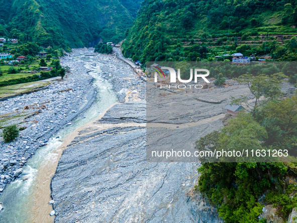 The aerial view shows the flood-affected areas of the Kulekhani River in the Sisneri region of Makwanpur, Nepal, on October 2, 2024. Thirty-...