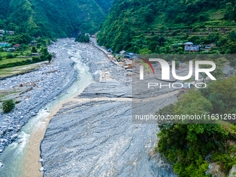 The aerial view shows the flood-affected areas of the Kulekhani River in the Sisneri region of Makwanpur, Nepal, on October 2, 2024. Thirty-...