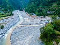 The aerial view shows the flood-affected areas of the Kulekhani River in the Sisneri region of Makwanpur, Nepal, on October 2, 2024. Thirty-...