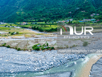 The aerial view shows the flood-affected areas of the Kulekhani River in the Sisneri region of Makwanpur, Nepal, on October 2, 2024. Thirty-...