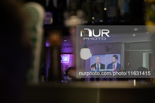 A mirror behind the bar reflects the vice presidential debate between Demcocrat Gov. Tim Walz (D-MN) and Republican Sen. J.D. Vance (R-OH) a...