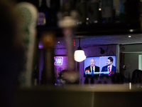 A mirror behind the bar reflects the vice presidential debate between Demcocrat Gov. Tim Walz (D-MN) and Republican Sen. J.D. Vance (R-OH) a...