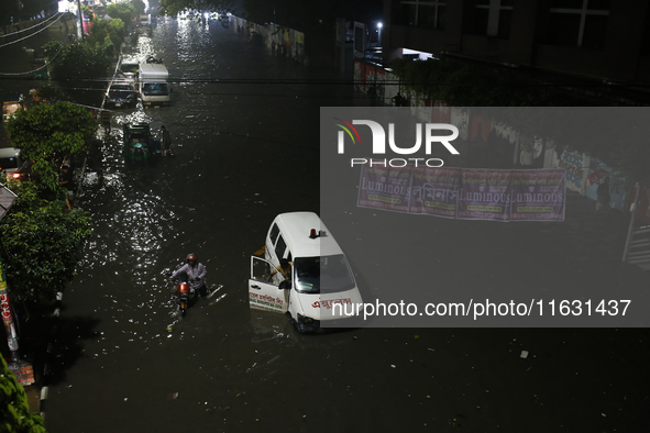 An ambulance is stuck on a waterlogged street following heavy rainfall in Dhaka, Bangladesh, on October 2, 2024. Several roads in the capita...