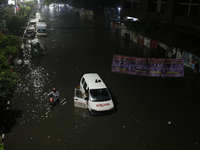 An ambulance is stuck on a waterlogged street following heavy rainfall in Dhaka, Bangladesh, on October 2, 2024. Several roads in the capita...