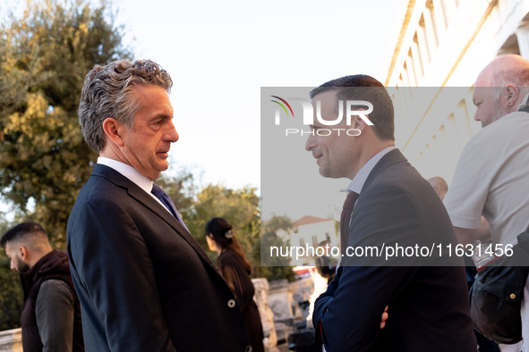 Stephen Dunbar-Johnson, the president of International of The New York Times Company, and Haris Doukas, the Mayor of Athens, participate in...