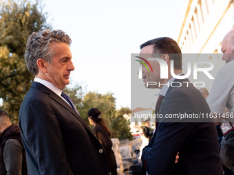 Stephen Dunbar-Johnson, the president of International of The New York Times Company, and Haris Doukas, the Mayor of Athens, participate in...