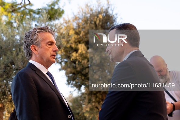 Stephen Dunbar-Johnson, the president of International of The New York Times Company, and Haris Doukas, the Mayor of Athens, participate in...