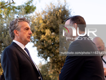 Stephen Dunbar-Johnson, the president of International of The New York Times Company, and Haris Doukas, the Mayor of Athens, participate in...