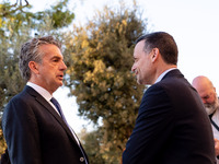 Stephen Dunbar-Johnson, the president of International of The New York Times Company, and Haris Doukas, the Mayor of Athens, participate in...