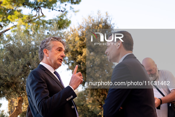 Stephen Dunbar-Johnson, the president of International of The New York Times Company, and Haris Doukas, the Mayor of Athens, participate in...