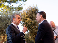 Stephen Dunbar-Johnson, the president of International of The New York Times Company, and Haris Doukas, the Mayor of Athens, participate in...