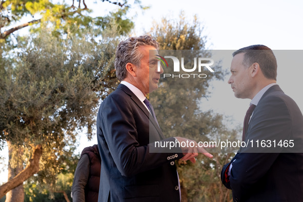 Stephen Dunbar-Johnson, the president of International of The New York Times Company, and Haris Doukas, the Mayor of Athens, participate in...