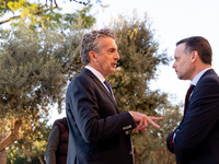 Stephen Dunbar-Johnson, the president of International of The New York Times Company, and Haris Doukas, the Mayor of Athens, participate in...