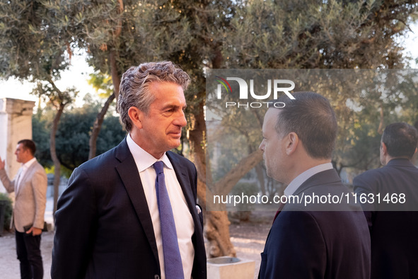 Stephen Dunbar-Johnson, the president of International of The New York Times Company, and Haris Doukas, the Mayor of Athens, participate in...